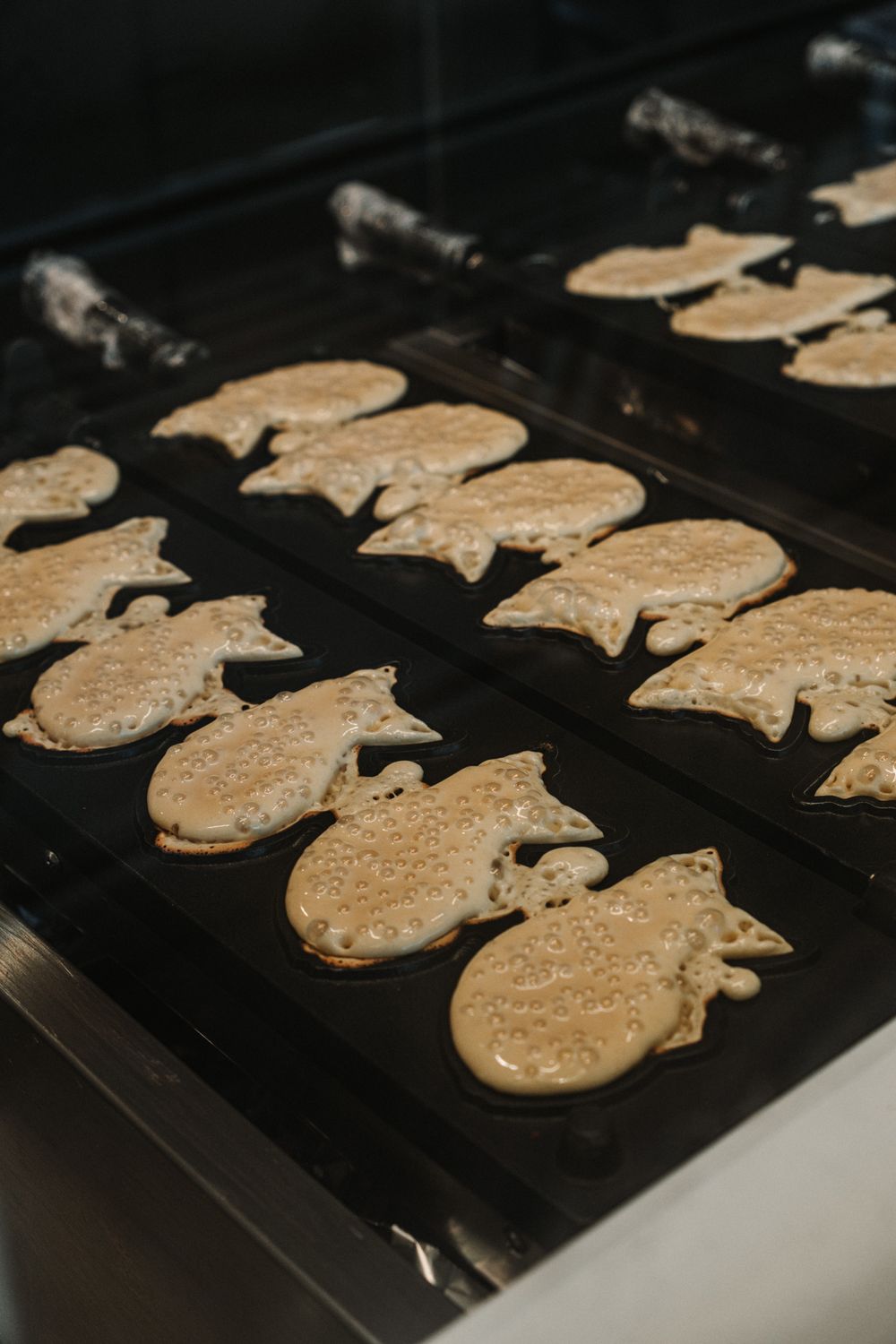 Taiyaki batter pressed fresh in fish-shaped molds