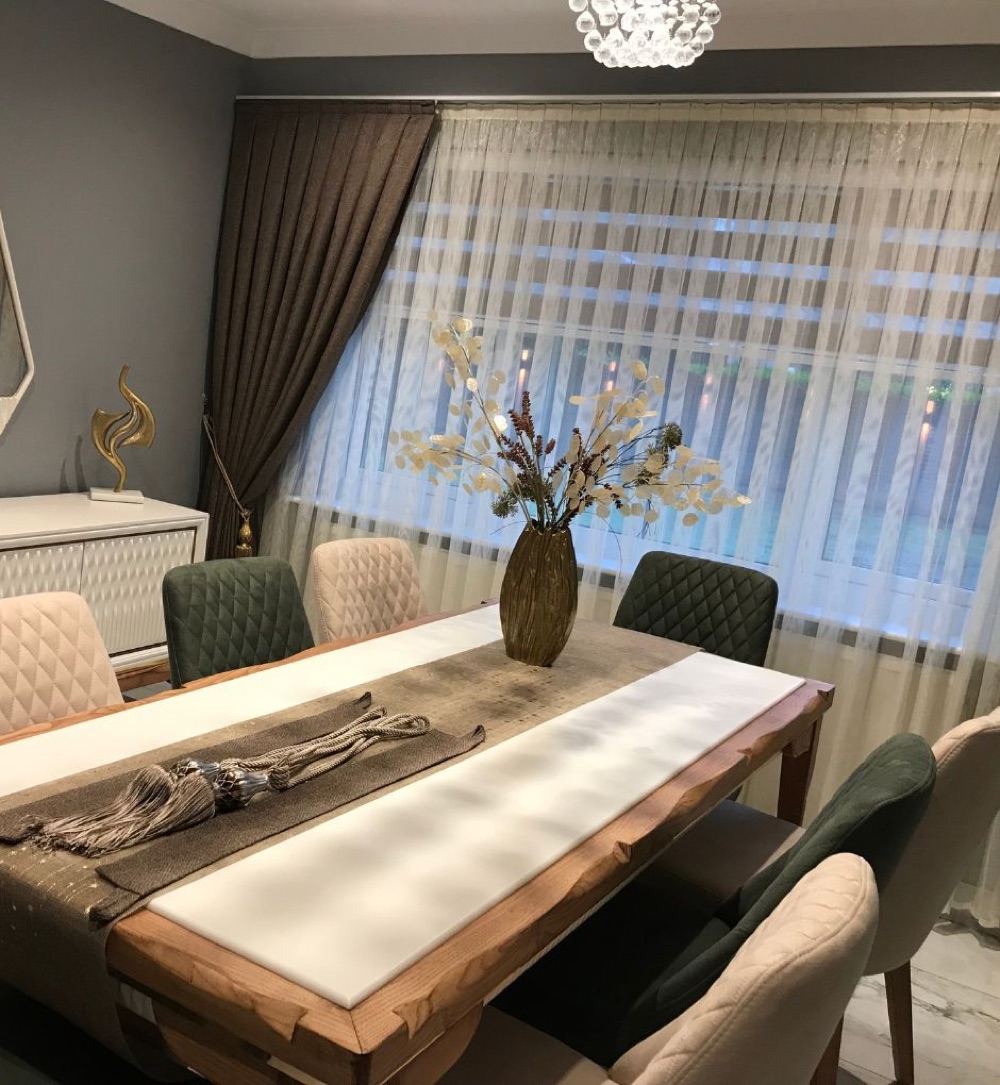 Drapery framing a dining room window