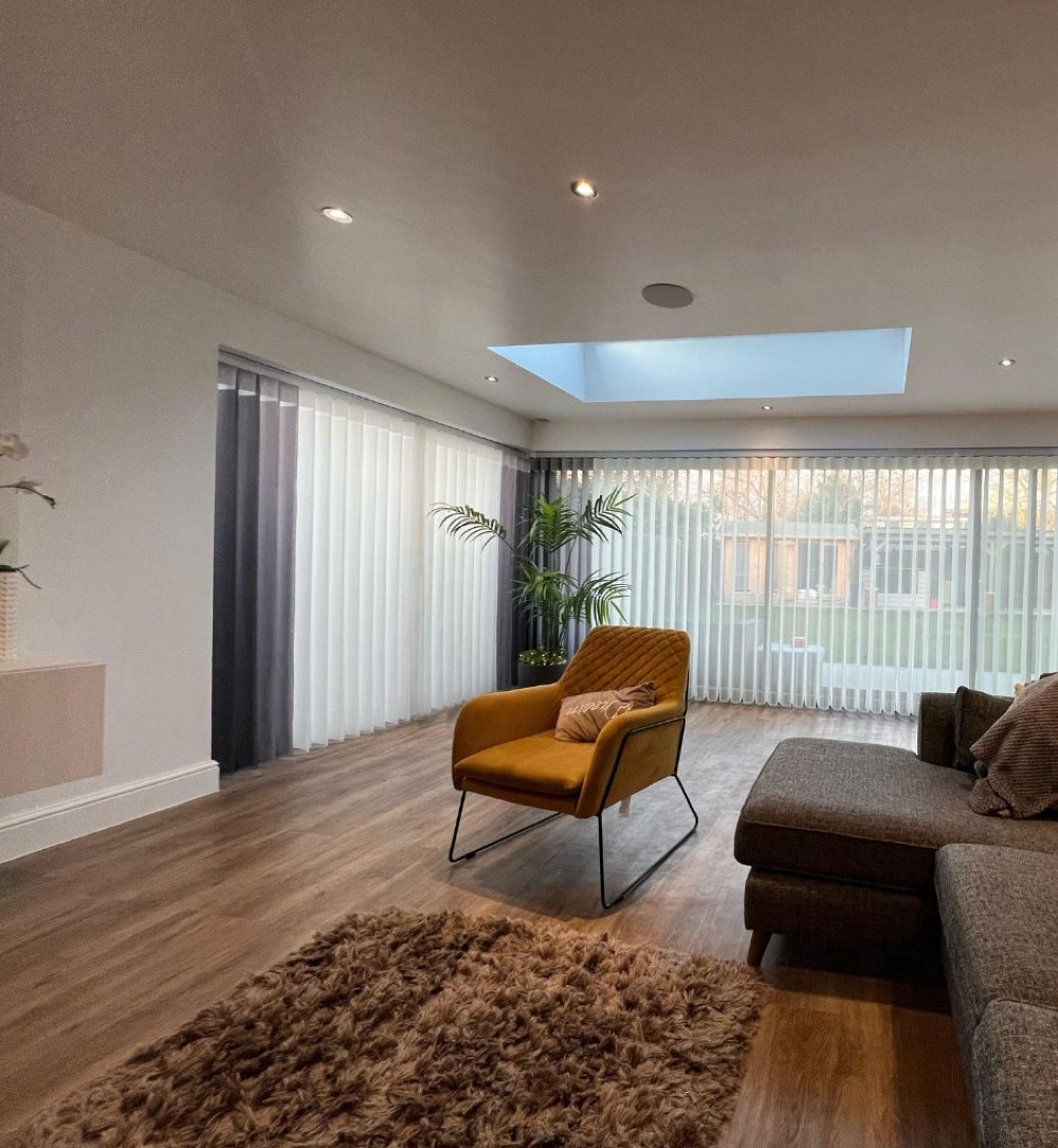Minimalist living room with sheer vertical shades
