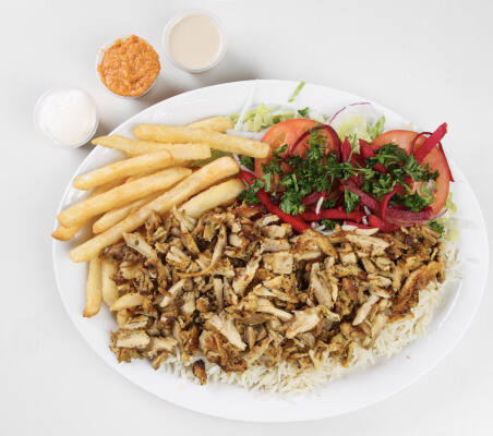 Chicken shawarma plate with fries, rice and salad